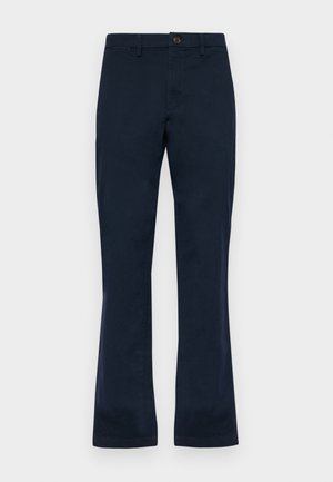Pantalons en coton bleu marine avec une coupe droite, présentant une fermeture à bouton à l'avant, des passants de ceinture et deux poches latérales. Texture lisse.