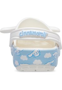 Cinnamoroll-themed clogs with a light blue base, white fluffy cloud design, and white straps. Made of soft, textured material.