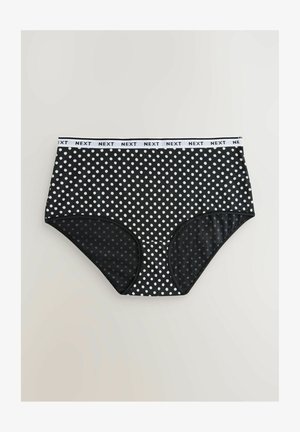 Zwarte hoogwater slips met witte polka dots, voorzien van een witte elastische tailleband met "NEXT" branding en glad, rekbaar materiaal.