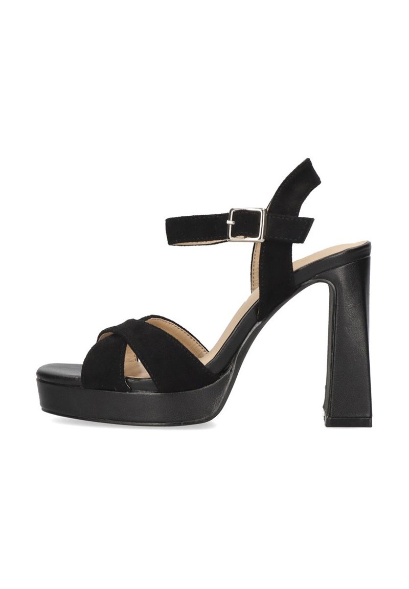 Las sandalias de tacón alto de ante negro cuentan con una suela de plataforma, un diseño de tira cruzada y una correa de tobillo ajustable con un hebilla de plata.