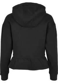 Fekete kapucnis pulóver, hosszú ujjakkal és peplum derékkal. Puha anyagból készült, sima tapintású, bordás mandzsettákkal.
