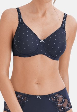 Granatowy biustonosz w jasne kropki z ramiączkami obszytymi koronką, zestawiony z pasującymi granatowymi majtkami z wysokim stanem, zdobionymi koronką i haftem.