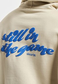 DEF GAME - Hoodie - sand