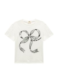 Camiseta de algodón blanca con un gran gráfico de lazo negro y el texto "BUENO Y POSITIVO" debajo. Cuello redondo y mangas cortas.