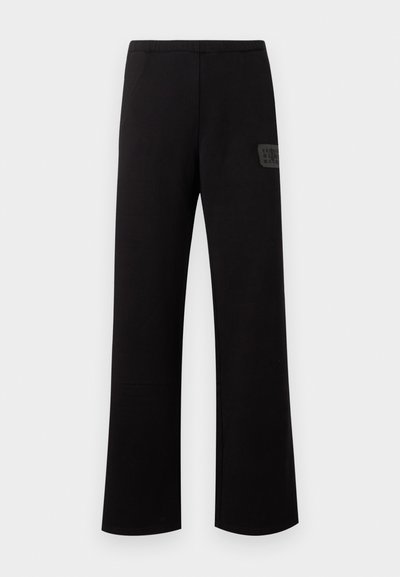 Μαύρο παντελόνι με ίσια γραμμή, ελαστική μέση και μικρό ορθογώνιο λογότυπο στο δεξί μηρό.