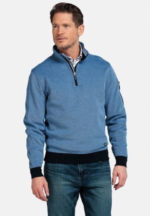 Blauwe kwart-ritssweater met geribde zwarte manchetten en zoom, gemaakt van een gestructureerde stof. Bevat een borstzak met ritsdetail.