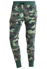 Kamouflage joggers i mjukt tyg, med resårmidja och dragsko, dragkedjefickor och tapered ben-design.