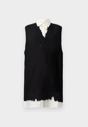Black knit sleeveless sweater with a v-neck, featuring frayed edges and a white collared shirt underneath. Textured with visible stitching.