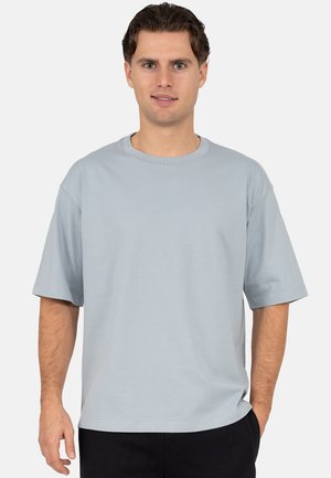 Light blue short-sleeve t-shirt with a crew neck, made of soft cotton, featuring a relaxed fit and smooth texture. No patterns or accents.