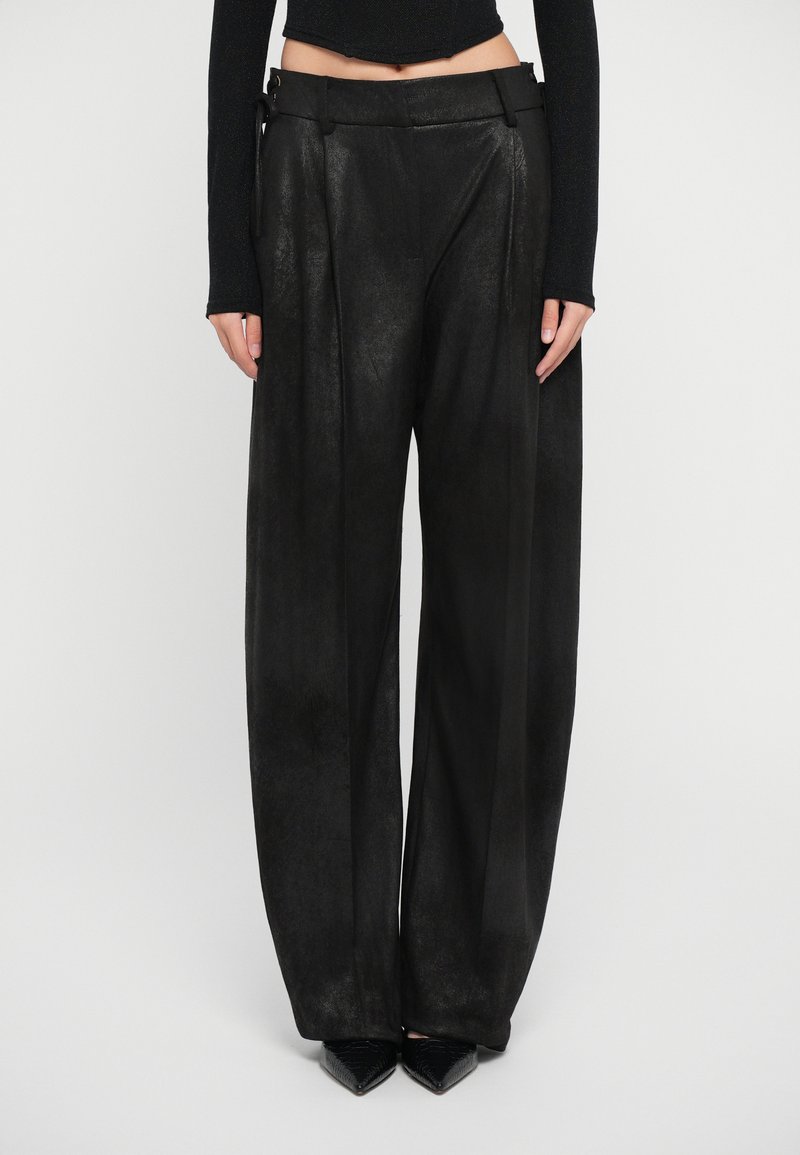 Black wide-leg trousers made from a textured material, featuring pleats, a high waist, and a decorative belt with hardware accents.