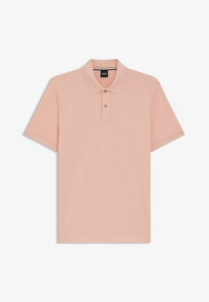 Polo shirt in light pink, made of soft cotton, featuring a collar, short sleeves, and three-button placket. Subtle brand logo on chest.