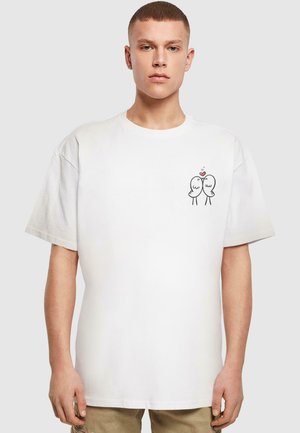 White cotton t-shirt featuring a simple black graphic of two cartoon birds with a heart above, short sleeves, and a relaxed fit.