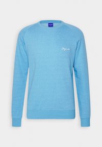 Himmelblå sweatshirt med en texturerad mönstring, ribbade ärmslut och fåll. Har en liten vit "Originals"-logotyp på framsidan.