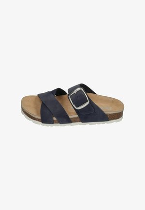 Men's casual slide sandal with dark navy crossed straps, large silver buckle, cork footbed, and white rubber sole.