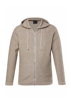 Beige neulottu hupullinen vetoketjutakki, jossa on pitkät hihat ja kiristysnauhat, hienovaraisella tekstuurilla ja pienellä lipukkeella helman lähellä.