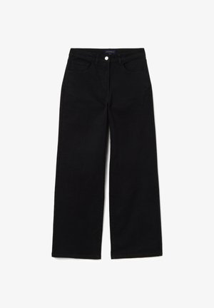 Zwarte jeans met wijde pijpen gemaakt van stevig katoen met een gladde textuur. Voorzien van vijf zakken en een knoopsluiting aan de voorkant.