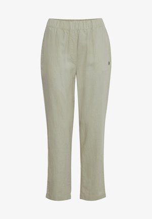 Világoszöld vászon nadrág elasztikus derékkal és laza szabással. Enyhe textúrával és egy apró logó részlettel az oldalon.