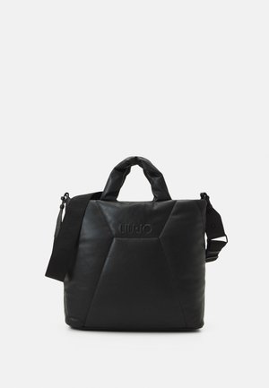 Black padded square tote bag with short handles, adjustable shoulder strap, and embossed "LIU JO" logo on front.