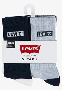Šešių porų berniukų kojinių rinkinys tamsiai mėlynos, šviesiai mėlynos ir baltos spalvų. Su raukšlėtu paviršiu ir baltu "Levi's" logo. Įprastas kirpimas, supakuotas su pakabuku.