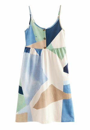 Robe sans manches avec fines bretelles, boutonnée devant, et patchs géométriques abstraits en bleu, vert, beige et blanc.