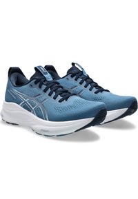 Scarpe da atletica blu con una tomaia testurizzata, dotate di un design con lacci, dettagli argento e una suola intermedia spessa bianca per l'ammortizzazione.