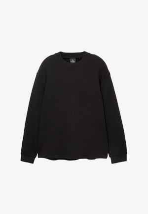 Sweatshirt noir à manches longues, col rond et poignets côtelés. Tissu doux, coupe légèrement ample, sans motifs ni logos visibles.
