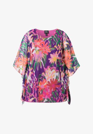 Haut fleuri multicolore à manches courtes, avec un motif vibrant de violet, rose, orange et vert, et un col rond. Tissu léger.