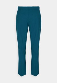Pantalons ajustés teal avec une texture lisse, présentant une coupe slim, deux poches arrière et un design à jambe droite.