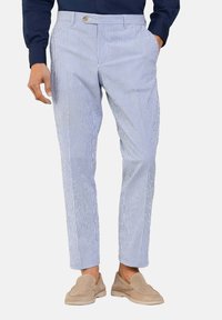 Men's striped trousers in light blue and white cotton with a slim fit, featuring belt loops, side pockets, and a button closure.