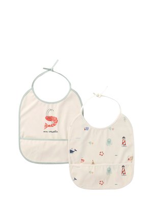 Two cream-colored baby bibs with sea-themed prints; one has a smiling shrimp and "ma crevette" text, the other has lighthouses and marine creatures.