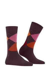 Chaussettes montantes de couleur marron foncé avec un motif argyle comportant des diamants roses, rouges, orange et violets. Texture douce avec un haut élastique.