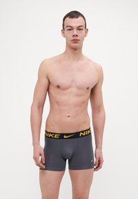 Nike Underwear TRUNK 3 PACK - Calzoncillos - uni gold/dark grey/blue void