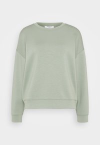 Sudadera verde claro hecha de tela suave, con cuello redondo, hombros caídos y puños acanalados, con un ajuste relajado y ancho.