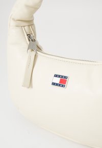 Tommy Jeans PILLOW MINI HOBO - Handbag - offwhite