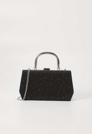 Sac à main noir avec une forme hexagonale structurée, embellie de bijoux noirs facettés, avec une poignée métallique et une bandoulière en chaîne.