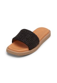 Black woven slide sandal with a wide strap, tan cushioned footbed, and light brown textured outsole. Closed toe design and flat sole.