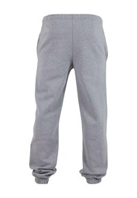 Pantalons de survêtement gris en tissu doux, dotés d'une taille élastique et de poignets, avec deux poches latérales pour plus de praticité.