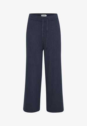 Tumes ribad laiad püksid, millel on nööriga vöökoht. Kanga näTexture tundub pehme ja disainil on tekstuuri tekitamiseks vertikaalsed jooned.