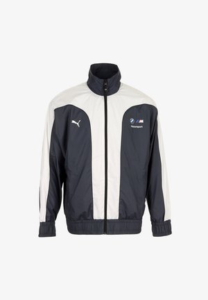 Veste zippée Puma bleu marine et blanc avec logos BMW Motorsport, poignets élastiques et col montant.