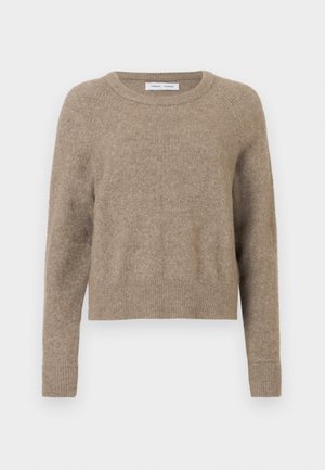 Beige crew-neck sweater made of soft fabric. Features ribbed cuffs and hem, with a slightly cropped design and minimal texture.