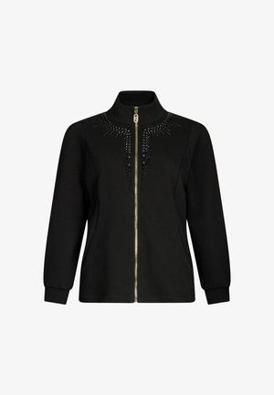Giacca nera con zip realizzata in tessuto liscio, caratterizzata da un colletto alto, maniche lunghe e dettagli decorativi con borchie sul petto.