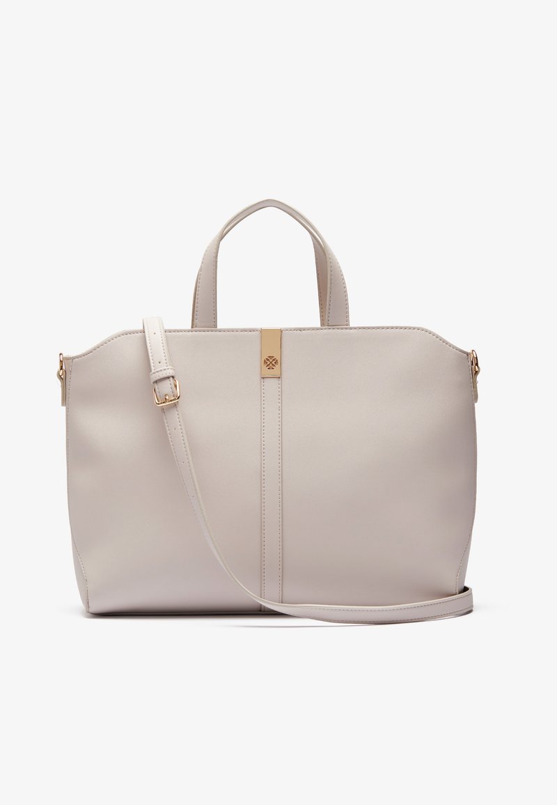 Light beige tote bag made of smooth synthetic material, featuring dual handles, a detachable shoulder strap, and a gold accent on the front.