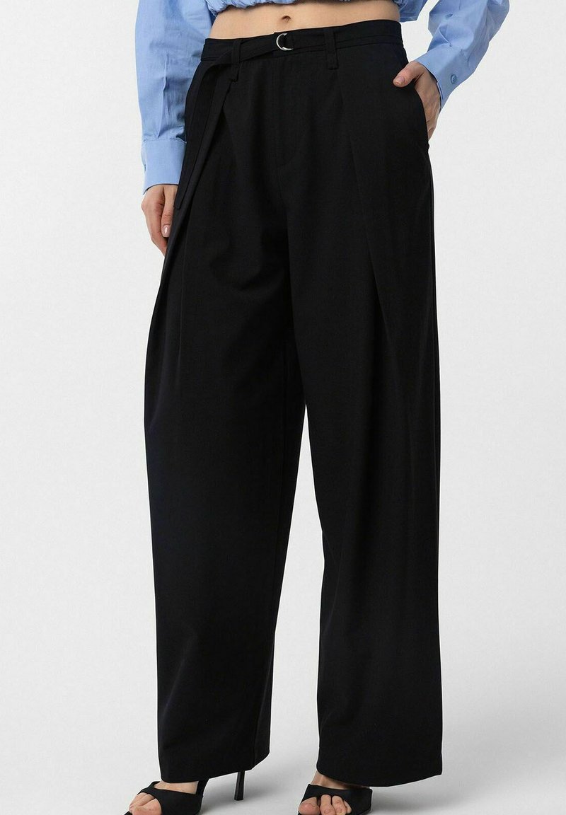 Black wide-leg trousers with a high waist, belt loops, pleats, and a smooth texture. Paired with a light blue long-sleeve shirt.