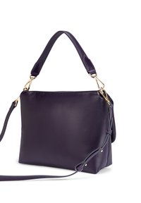 Purple leather handbag with a smooth texture, featuring gold hardware, one top handle, and a detachable shoulder strap.