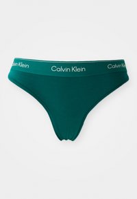 Teal katoenen thong met een smalle elastische tailleband met het "Calvin Klein" logo in het wit. Zachte textuur, naadloos ontwerp en lage taille.