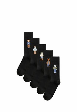Fünf schwarze Socken, jede mit einem anderen bestickten Tiercharakter, der Kleidung trägt, in einer Reihe angeordnet.