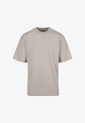 Beige T-Shirt mit kurzen Ärmeln aus Baumwolle. Es hat einen Rundhalsausschnitt und einen lässigen Schnitt, ohne sichtbare Muster oder Beschläge.