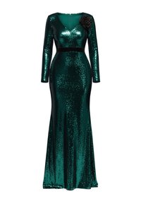 Langærmet kjole i dyb grøn med palietter og tætsiddende silhuet, med en V-udskæring og en sort blomsterdekoration på skulderen.