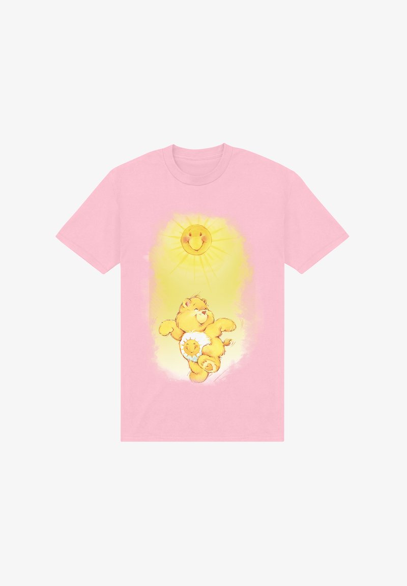 Pink t-shirt featuring a yellow bear with a sun emblem on its belly, surrounded by a sunburst design above.