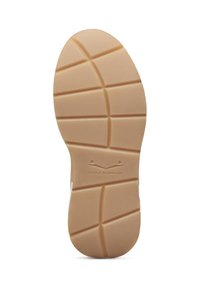 Sulan p�å en sneakers, tillverkad av ljusbrunt gummi med ett texturerat, mönstrat greppdesign. Har en logotyp präglad nära hälen.